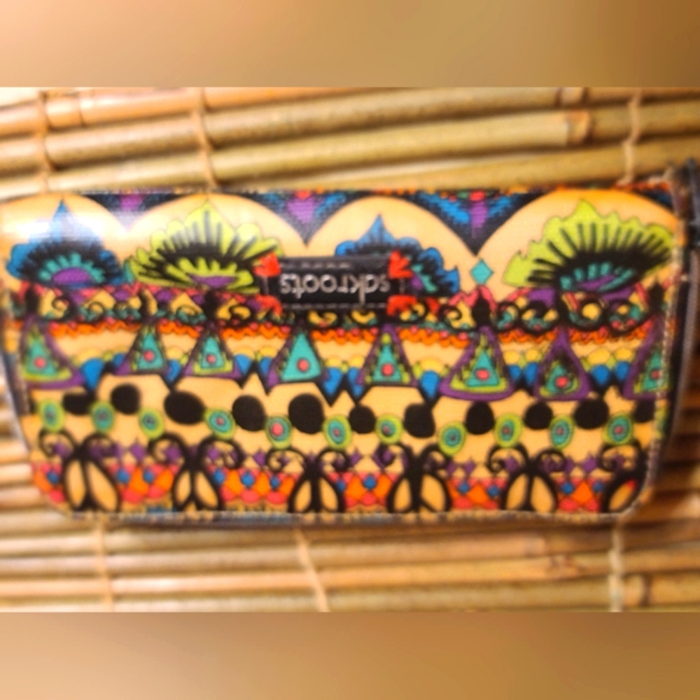 Sakroots Zip Around Wallet. Measures: 8.5" X 4.5". 